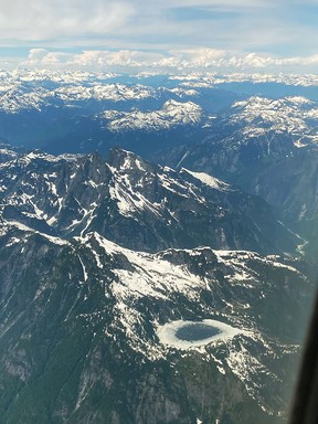 The flight from Vancouver to Terrace over snow-capped peaks over green stripes, including the 