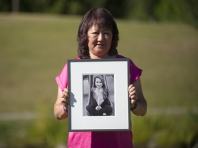 Carol Todd holds a photo of her daughter Amanda.