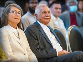 Renowned architect Moshe Safdie, with wife Michal at his side, listens to his introduction by principal Suzanne Fortier before the announcement of his donations to McGill University in Montreal on Tuesday, Aug. 23, 2022.