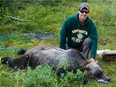 Clayton Lamb, a post-doctoral student at UBCO shown here with a tranquilized bear, has lobbied for a later start to the trapping season in southeast B.C. after discovering seven per cent of the grizzly bears they studied had toes chopped off by marten traps.