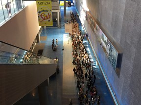 Shoppers line up for the annual Aritzia Warehouse Sale at the Vancouver Convention Centre West on Aug. 27, 2019.