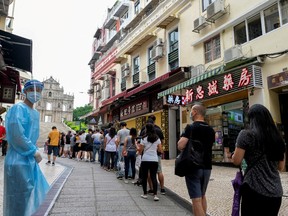 People queue for COVID-19 testing near the Ruins of Saint Paul's in Macau, China June 20, 2022.