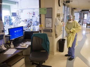 A patient in intensive care with COVID-19 at Surrey Memorial Hospital in a June 2021 file photo.