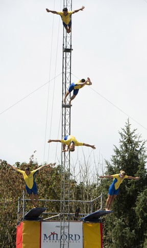 Entertainers participate in the Flying Fools High Diving Show at the Pacific National Exhibition on Saturday, Aug. 20, 2022. The high diving show returns to the PNE this year after a 15 year absence.