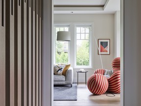 A classic Up by B&BItalia striped armchair is a fun conversation piece in the living room.