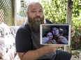 Mathieu Taillefer displays a photo of his wife, Gulmira, and their children Chanel and Tristan.