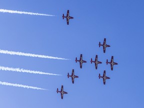 The Snowbirds fly over Vancouver's English Bay before Canada's performance at the Celebration of Light fireworks festival on Wednesday, July 27, 2022.