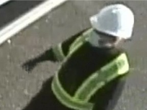 Coquitlam RCMP released video surveillance of the two suspects that helped Rabih “Robby” Alkhalil escape from North Fraser Pretrial on July 21, 2022. The first suspect is described as a caucasian man, last seen wearing a white hard hat, a face mask, black shirt with a high visibility vest, black pants, black gloves, and black boots.