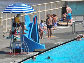 Lifeguard in action at Kits Pool as a shortage lifeguards have forced the closures of some pools in Vancouver, BC., on August 1, 2022.