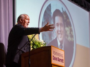 Premier John Horgan speaks at a memorial for Dave Barrett in 2018.