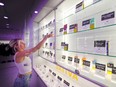 Teija Gladson of THC Canada on Main Street in Vancouver re-stocks shelves as best she can amid a shortage of cannabis.