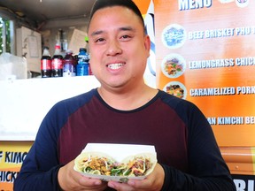 Giang Nguyen of The Taco Tigre with the Brisket Beef Pho Taco in action during a media event to promote the new dishes available this year at the PNE in Vancouver, BC., on August 24, 2022.