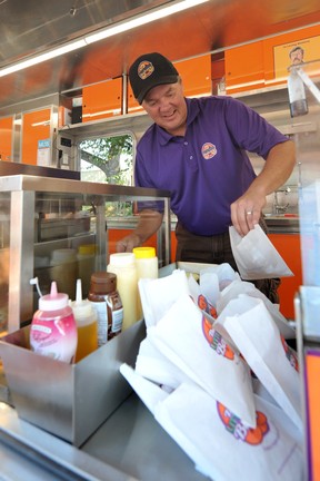 Keith Bedford of the Little Donut Bakery in action during a media event to promote the new dishes available this year at the PNE in  Vancouver,  BC., on August 24, 2022.