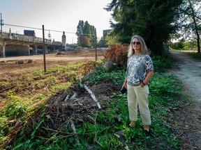 Eve Munro, who's with the Kitsilano Resident Association, beside planned road through Vanier park in Vancouver, BC., August 25, 2022. Munro says the development plan is too dense and her group opposes the road through the park.