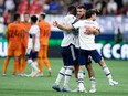 Vancouver Whitecaps' Lucas Cavallini, back right, Tosaint Ricketts (87) and Russell Teibert (31) celebrate after Vancouver defeated the Houston Dynamo during an MLS soccer game in Vancouver, on Friday, August 5, 2022.