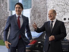 Canadian Prime Minister Justin Trudeau is greeted by German Chancellor Olaf Scholz as he arrives at the Chancellery in Berlin, Germany, Wednesday, March 9, 2022.
