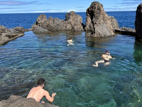 Swimmers enjoy natural saltwater pools formed over thousands of years by cooling lava on the northwest tip of Madeira.