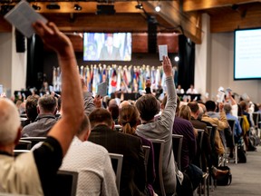 Delegate votes at the UBCM convention in Whistler on Sept. 14, 2022.