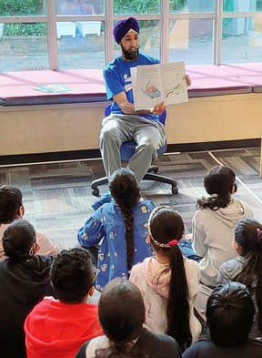 With the help of Raise-a-Reader funds, Burnaby Neighborhood House hosted virtual readings by Harman Pandher of his book Gurpreet Goes to Gurdwara.  He is seen here reading at Beaver Creek Elementary School, where he teaches.