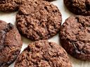 Cowboy cookies are the original power bar. They are large, hearty and chewy oatmeal-based cookies made with large flaked, old-fashioned rolled oats, shredded coconut, nuts, and chocolate chips.