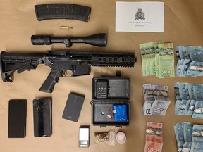 Handout photo from Surrey RCMP showing some of the items seized during an anti-gang enforcement project in Surrey on Sept. 10, 2022.