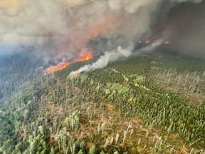 Aggressive fire activity driven by increased winds and temperatures has doubled the size of the Battleship Mountain wildfire.