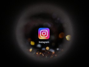 This file photo taken on Oct. 5, 2021, shows the U.S. social network Instagram logo on a smartphone screen.