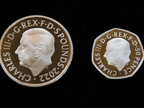 The official coin effigy of Britain’s King Charles III is seen on 5-pound and 50 pence coins unveiled by The Royal Mint, in London, Britain, September 29, 2022.