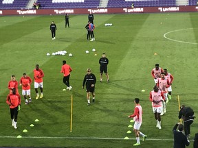 The Canadian starts warm up before facing Qatar in an international friendly at the Gererali Arena in Vienna, Austria on Sept. 23, 2022.