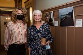 Study author Callista Ottani (left) with a guest on the opening night of the photography exhibit at Vancouver’s Barclay Manor, on Sept. 28, 2022.