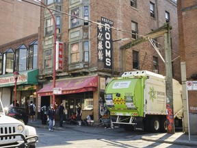 Displaced residents of Keefer Rooms outside their former residence on the 200-block of Keefer Street in Vancouver.