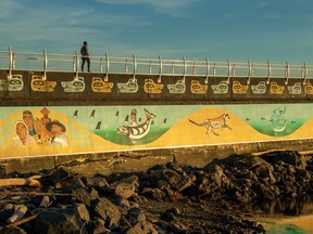 The 2.5-kilometre Ogden Point breakwater is a popular place for a walk. It also features the Unity Wall, created by First Nations artists.