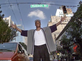NBA basketball player Steve Francis stops traffic in both directions on Robson Street in the heart of downtown Vancouver on July 21, 1999. The photo was taken a month after Francis was drafted by the Vancouver Grizzlies, a team he would never play for as he was traded to Houston before start of the season.