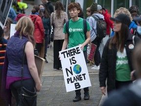 Various groups concerned with the environment gather at Coal Harbour Park in Vancouver on Friday, Sept. 23, 2022 for the Global Day of Action.