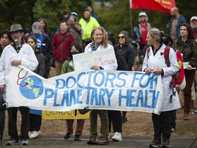 Various groups concerned with the environment gather at Coal Harbour Park in Vancouver on Friday, Sept. 23, 2022 for the Global Day of Action.