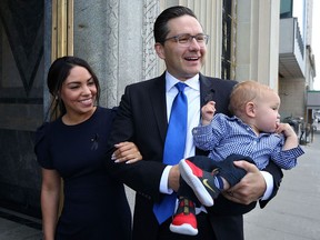 Newly elected Conservative Leader Pierre Poilievre, his wife Anaida and son Cruz arrive at a caucus meeting in Ottawa on Sept. 12, 2022.