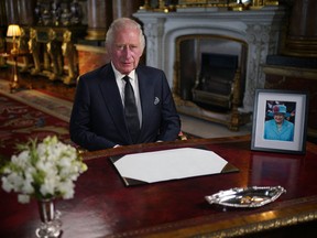 Britain's King Charles III makes a televised address to the Nation and the Commonwealth from the Blue Drawing Room at Buckingham Palace in London on September 9, 2022, a day after Queen Elizabeth II died at the age of 96.