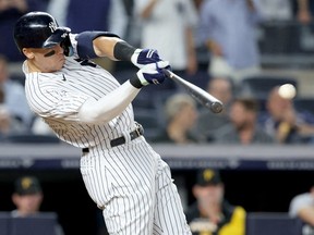 New York Yankees right fielder Aaron Judge hits a ground rule double against the Pittsburgh Pirates during the fifth inning at Yankee Stadium.
