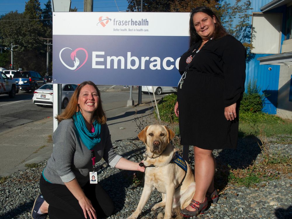  nurse practitioners hannah varto (left) and jen ehirchiou with pads dog levi.