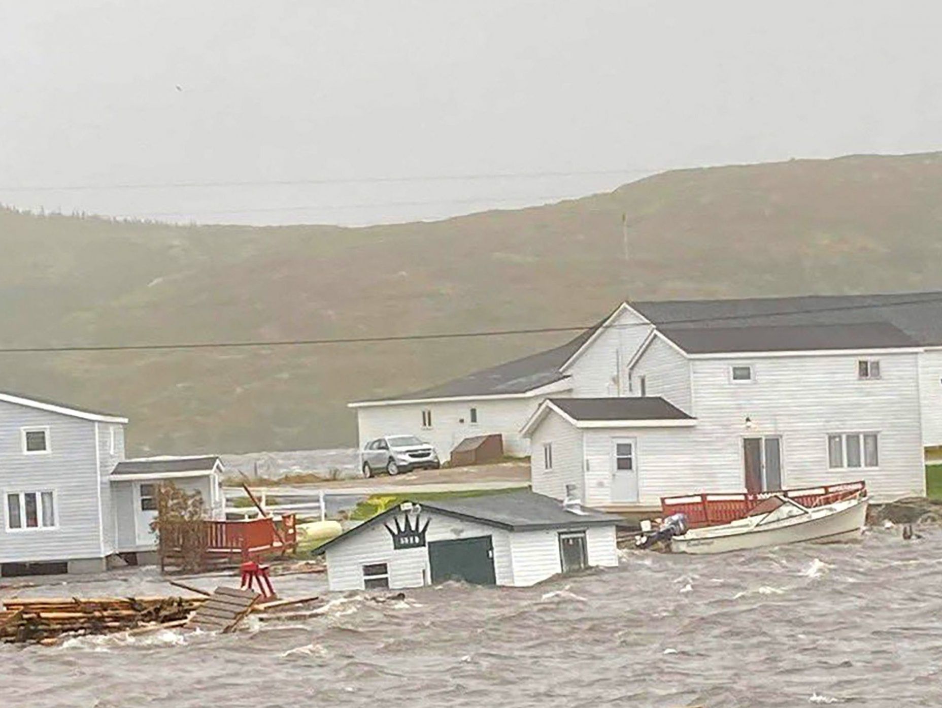 Fiona washes away homes in Newfoundland as storm wreaks havoc across Atlantic region