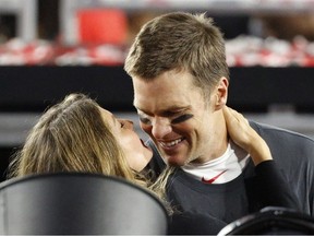 Tampa Bay Buccaneers' Tom Brady and his wife Gisele Bundchen celebrate after winning Super Bowl LV on February 7, 2021 in Tampa.