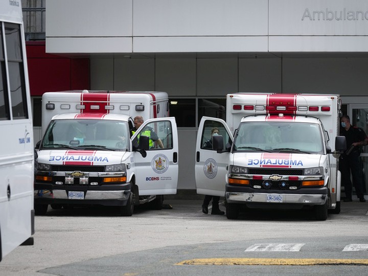  Paramedics and ambulances are seen outside the emergency department at Burnaby Hospital in Burnaby on Monday, May 30, 2022.
