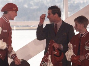 Royals Prince William, Prince Charles and Prince Harry check out the Roots Canadian Olympic Team jackets and trademark hats presented to them by Roots founders Don Green and Michael Budman in 1998. (Ian Lindsay/PNG)