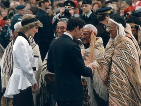 Prince Charles and Princess Diana greet members of the Musqueam band after they arrived at the Expo site Friday. Band members danced for the royal visitors as they ended their False Creek cruise on May 3, 1986. (Jon Murray/PNG)