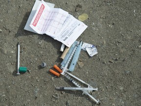 Needles are seen on the ground in Oppenheimer Park in Vancouver's Downtown Eastside on March 17, 2020.