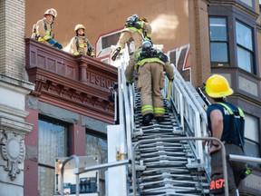 Vancouver firefighters put out a fire at 12 E. Hastings Street in Vancouver on Sept. 9, 2022.