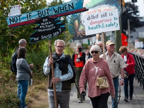 People march to protest the Trans Mountain Pipeline expansion on Saturday in Burnaby.