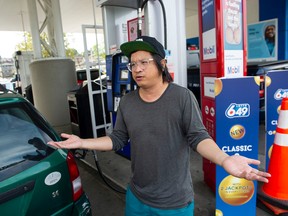 North Vancouver, BC: SEPTEMBER 28, 2022 -- Gip Mar fills up his car in Vancouver, BC on Wednesday, September 28, 2022. Rising fuel and food prices make it difficult for people to make ends meet.  (Photo by Jason Payne/ PNG) (For Nathan Griffiths story) [PNG Merlin Archive]