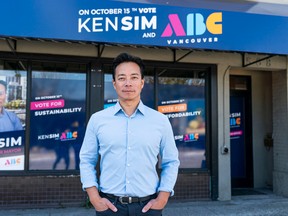 Ken Sim, the mayoral candidate for the ABC Vancouver party, poses for a photo outside the party's campaign office in Vancouver on Aug. 15, 2022.