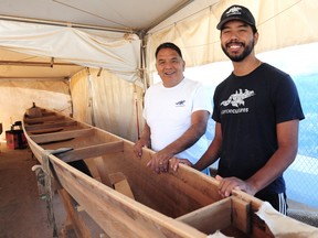 Master carver Mike Billy and his son, Mike Billy Jr.